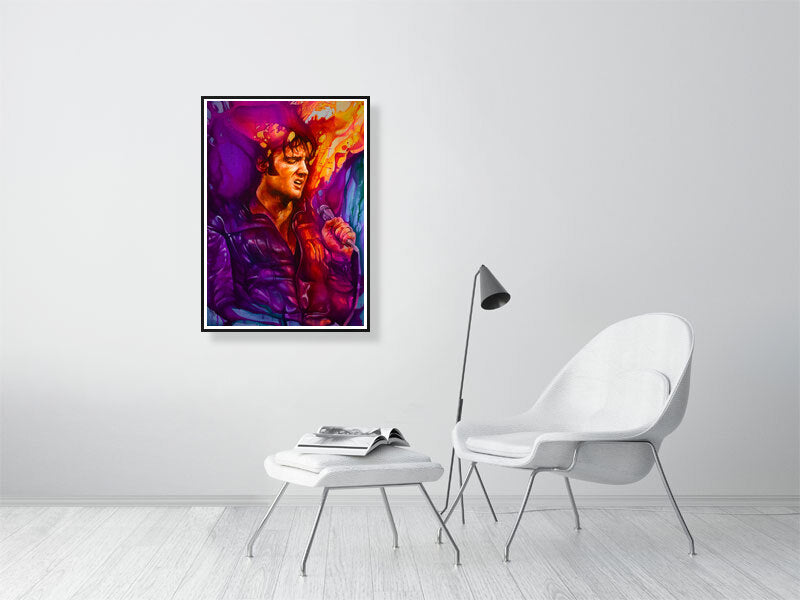 Colorful modern art portrait of a man singing, framed on a minimalist living room wall.